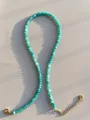 Detail van de turquoise kralenketting met vergulde karabijnsluiting en verlengstukje - Ketting / 38+5cm / Turquoise Groen