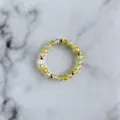 Detail of yellow faceted beads and golden accents on a handmade beaded elastic ring - Light Yellow Translucent Faceted Round Beads Style (E Ring)