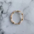 Macro detail of elastic bead ring with faceted peach gemstones and polished gold beads - Pale Peach Natural Stone Beads Style (F Ring)