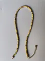 Detail of yellow faceted natural stone beads with gold plated lobster clasp and chain - Necklace / 38+5cm / Yellow Black Texture