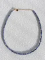 Detailed macro view of faceted blue natural stone beads with gold plated lobster clasp - Necklace / 38+5cm / Blue Sodalite