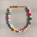 Detail of colorful heart beads and freshwater pearls on a vibrant charm bracelet - Colorful Shell and Artificial Pearl Bracelet / 17+3cm