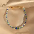 Macro shot of colorful spinel beaded bracelet on satin with a gold lobster clasp - Colorful Mineral Simple Style (Bracelet 10)