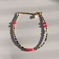Gedetailleerde weergave van kralenarmband met zwarte stenen en gouden accenten - Eén maat / Zwart Rood Roze Geslepen Kralen Parel Stijl (22) / 17+3cm