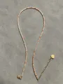 Detail of colorful beaded necklace featuring a golden heart pendant and lobster clasp - One Size / Orange Milk White Style (6 Necklaces)