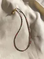 Close-up of thin red and green gemstone beaded necklace on silk with gold heart pendant - One Size / Red Green Alternating Style (7 Necklaces)