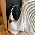 Minimalist beige hobo bag with leopard print eyewear charm and soft PU leather texture - With Pendant / White