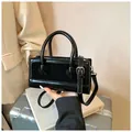 Black rectangular crossbody bag with glossy patent leather and matte suede patchwork - Black