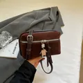 Coffee brown suede square crossbody bag with metallic robot charm and silver strap buckle - Coffee