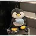 Cute penguin plush backpack in black and white with a soft blue fish plush accessory - With Fish Pendant / Small