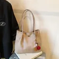 Minimalist beige matte tote bag with fuzzy ball charm on silver luggage handle - With Pendant / Khaki