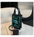 Dettaglio borsa nera a forma di libro con stampa verde Wicked Witch of the West - Stile Strega Cattiva (款二)