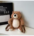 Detailed close-up of a brown plush teddy bear backpack with adjustable nylon straps - One Size / Khaki