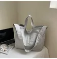 Detail of light grey textured canvas tote bag featuring dual handles and a long shoulder strap - Off-White