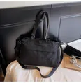 Large black nylon tote bag with adjustable strap and casual wrinkled texture for travel - Black