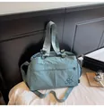 Light blue nylon tote bag with bicycle embroidery and adjustable shoulder strap - Blue