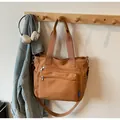 Caramel brown large nylon tote bag with multiple zippers and adjustable shoulder strap - Brown