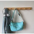 Bolso bandolera de nailon azul claro con correa ajustable y varios bolsillos - Talla única / Azul claro