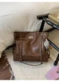 Detail of retro brown leather tote with chain handle and cute monster plush pendant - With Pendant / Coffee