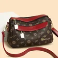 Borsa a tracolla bicolore marrone e rossa con stampa a fiori e logo a canguro - Taglia unica / Marrone & Rosso