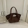 Deep brown matte suede handbag with silver metal lock and retro bucket bag silhouette - No Pendant / Coffee