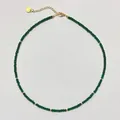 Macro view of green beaded necklace with 18k gold plated clasp and heart tag - Necklace / 38+5cm / Dark Green