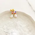 Close-up of 18K gold-plated hoop earrings with baroque pearls and colorful beads - Striped Bead Baroque Pearl Earring (Style F)
