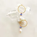 Detail of 18K gold earrings featuring a baroque pearl and blue striped bead on crystal stones - Nautical Blue White Striped Bead Hoop (Style B)