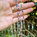 Detailed macro of multi-colored natural stone beaded necklace with gold extension chain - Colorful Faceted Gemstones (E) / 38cm+5cm