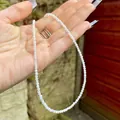 Macro shot of fine faceted white natural stone beads necklace with gold metal clasp - White Translucent Moonstone/Crystal (J) / 38cm+5cm