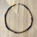 Detail von Tigerauge und Lavastein Perlenkette mit verstellbarer Edelstahlkette - Halskette (Verstellbar)