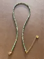 Macro detail of natural stone beaded necklace with green round beads and gold heart tag - One Size / Green And White Heart Style (Style 19)