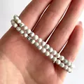 Detailweergave van dubbellaagse witte howliet natuurstenen kralen met grijze marmering - Howliet(Armband 10)