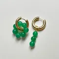 Gold hoop earrings featuring emerald green natural stone beads in an asymmetrical design - Asymmetric Cluster And Vertical Design / Green