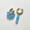 Asymmetric gold hoop earrings with light blue natural stone beads in a unique drop design - Asymmetric Cluster And Vertical Design / Light Blue