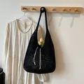 Black hollow woven knit tote bag with drawstring closure and large mesh design - One Size / Black