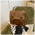 Retro brown multi-functional backpack with buckle straps and textured wash finish - Brown