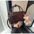 Dark brown trendy handbag with plush bear charm and adjustable shoulder strap - With Pendant / Coffee