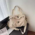 Beige nylon messenger bag with large capacity, dual handles and wide shoulder strap - One Size / White