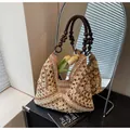 Large woven tote bag with brown wooden bead handles and tan mesh straw texture - Patterned Brown