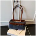 Retro blue denim underarm bag with brown leather belt detail and silver buckle accent - With Pendant / Blue/Brown