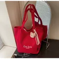 Red canvas tote bag with white text and plush bear charm for daily commute - With Pendant / Burgundy