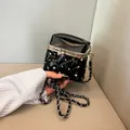 Elegant black quilted handbag with rhinestone accents and silver chain strap - Black