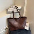 Large dark brown woven leather tote bag with long straps for commute minimalist design - Coffee