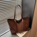 Dark brown hand-woven leather tote bag in a minimalist style for office commuting - Brown