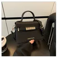 Classic black crossbody handbag with MARC ELIZA gold logo and textured leather finish - One Size / Black
