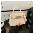 Cream Saffiano leather structured handbag with gold-tone hardware and adjustable strap - One Size / Off White