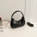 Glossy black crescent underarm bag with pleated leather and adjustable shoulder strap - Black