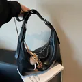 Minimalist black PU leather hobo tote bag with plush charm and adjustable strap - With Pendant / Black