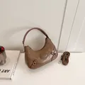 Brown vintage half-moon shoulder bag with pleated texture and adjustable strap - Khaki